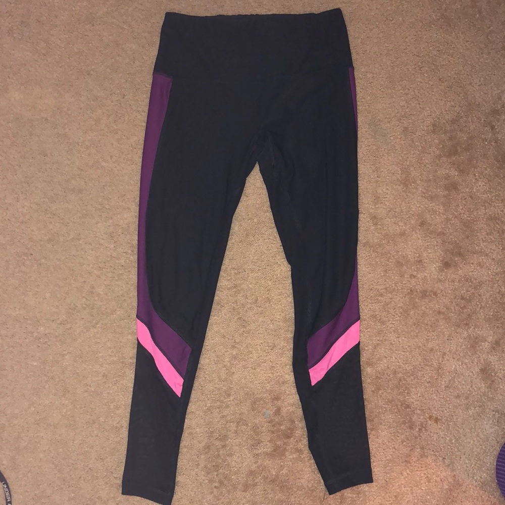 Black leggings with purple and bonk on the sides
